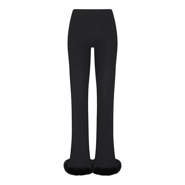 SKIMS CLOUD SLIM FLARE PANT | ONYX FLAT ON A WHITE BACKGROUND | FLT
