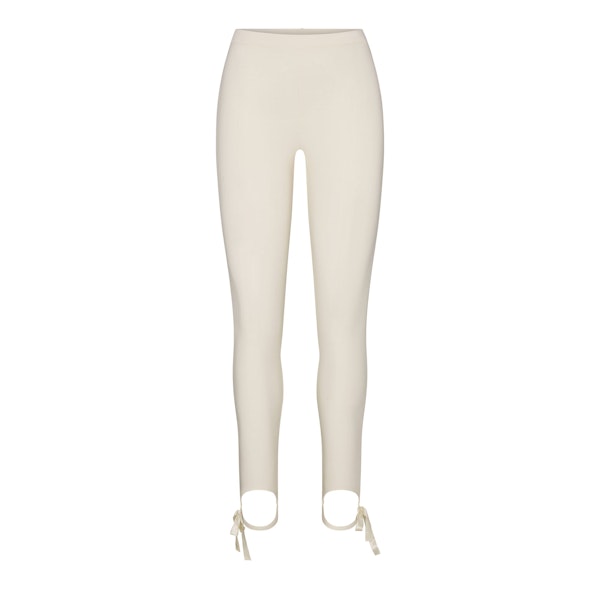 SKIMS CLOUD STIRRUP LEGGING | ECRU FLAT ON A WHITE BACKGROUND | FLT