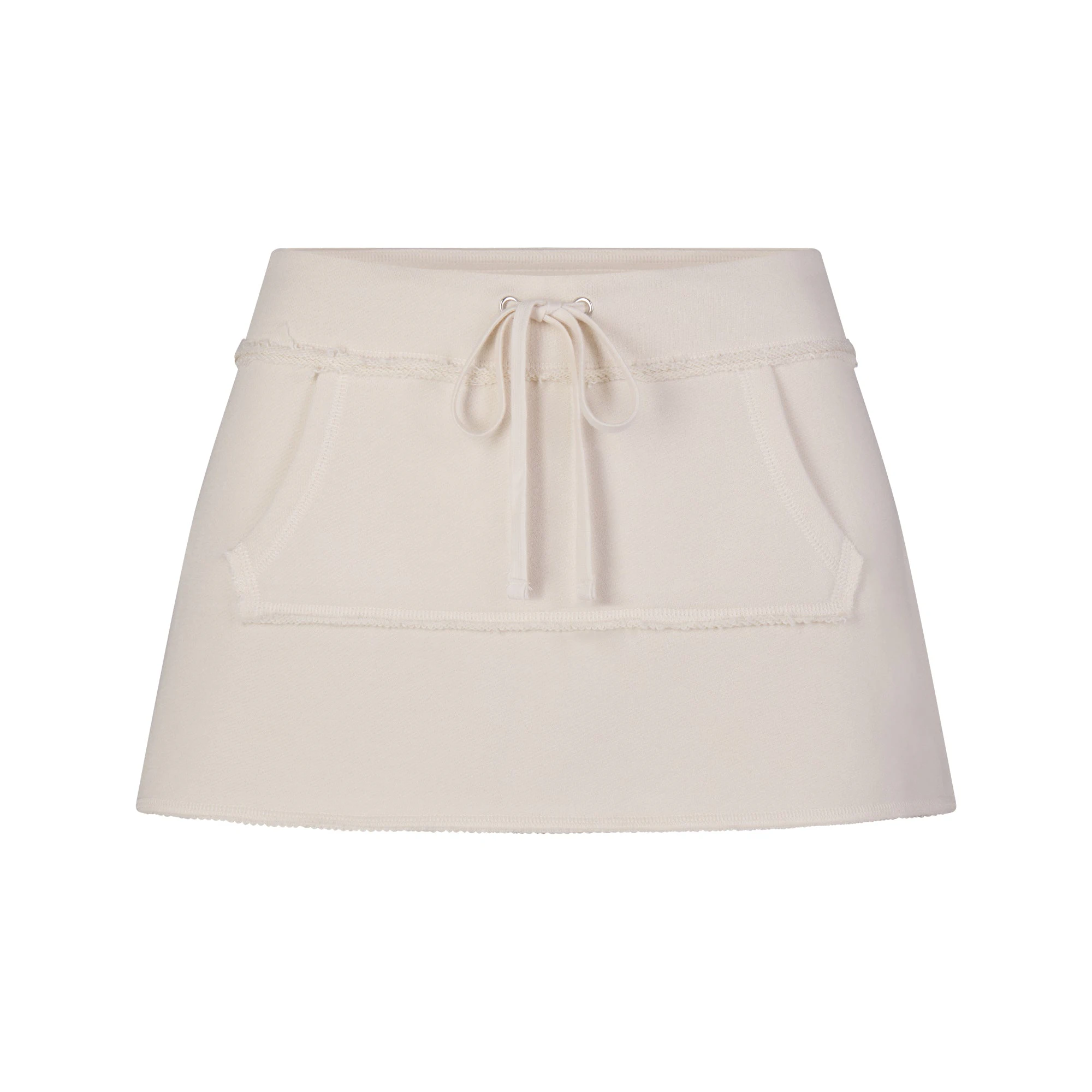 DRAPEY FRENCH TERRY MINI SKIRT | BUFF FLAT ON A WHITE BACKGROUND | FLT