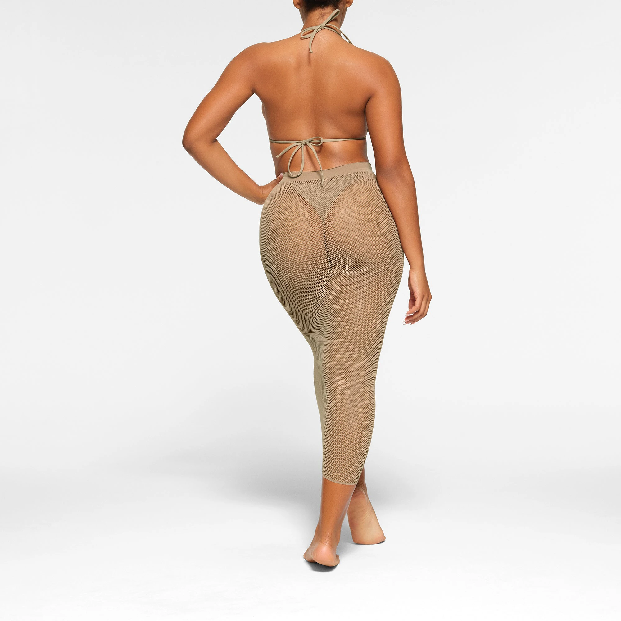 WARP KNIT COVER UP LONG TUBE SKIRT WORN BY A MODEL IN BACK VIEW