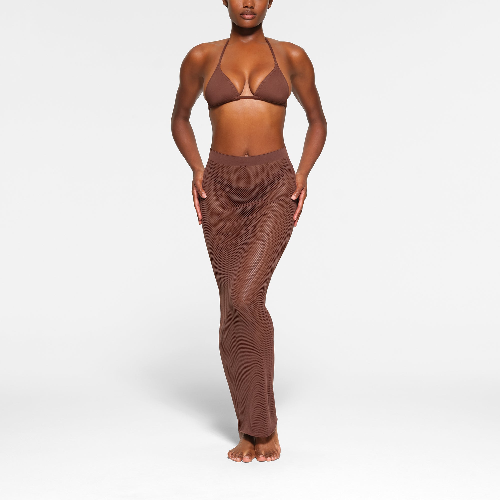 WARP KNIT COVER UP LONG TUBE SKIRT WORN BY A MODEL IN FRONT VIEW