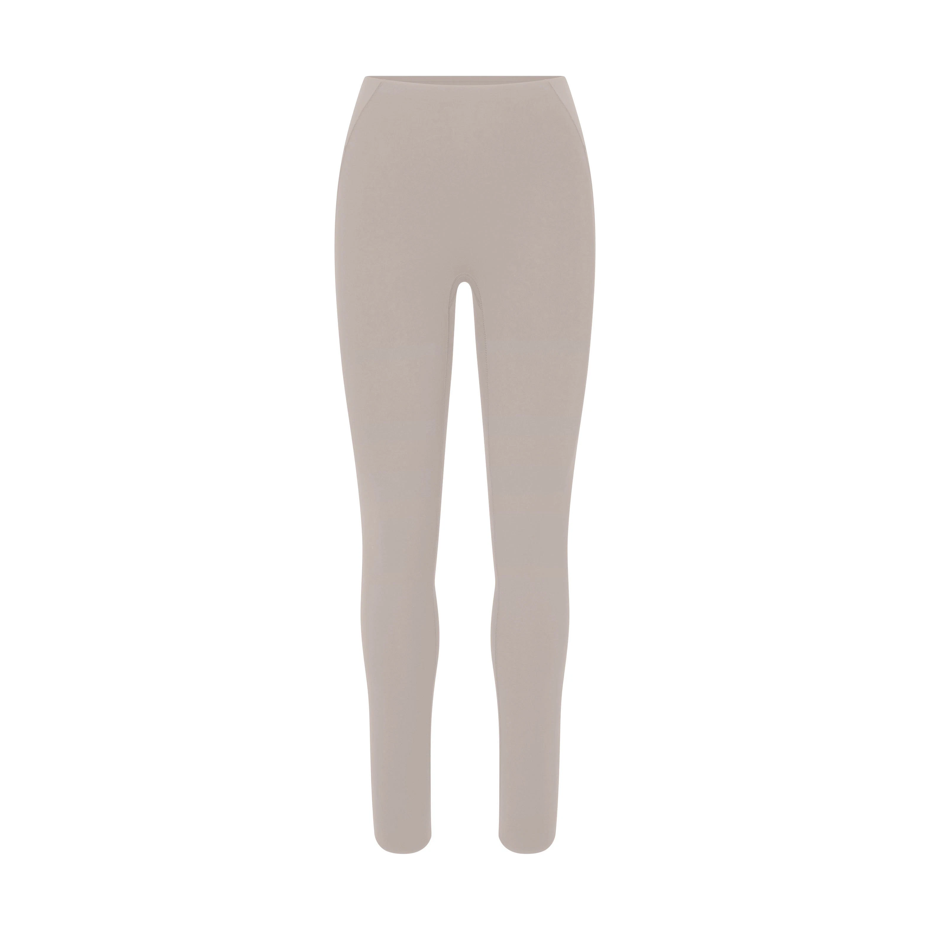 NikeSKIMS STUDIO STRETCH 26" LEGGING | LINENLAYS FLAT ON A WHITE BACKGROUND | FLT