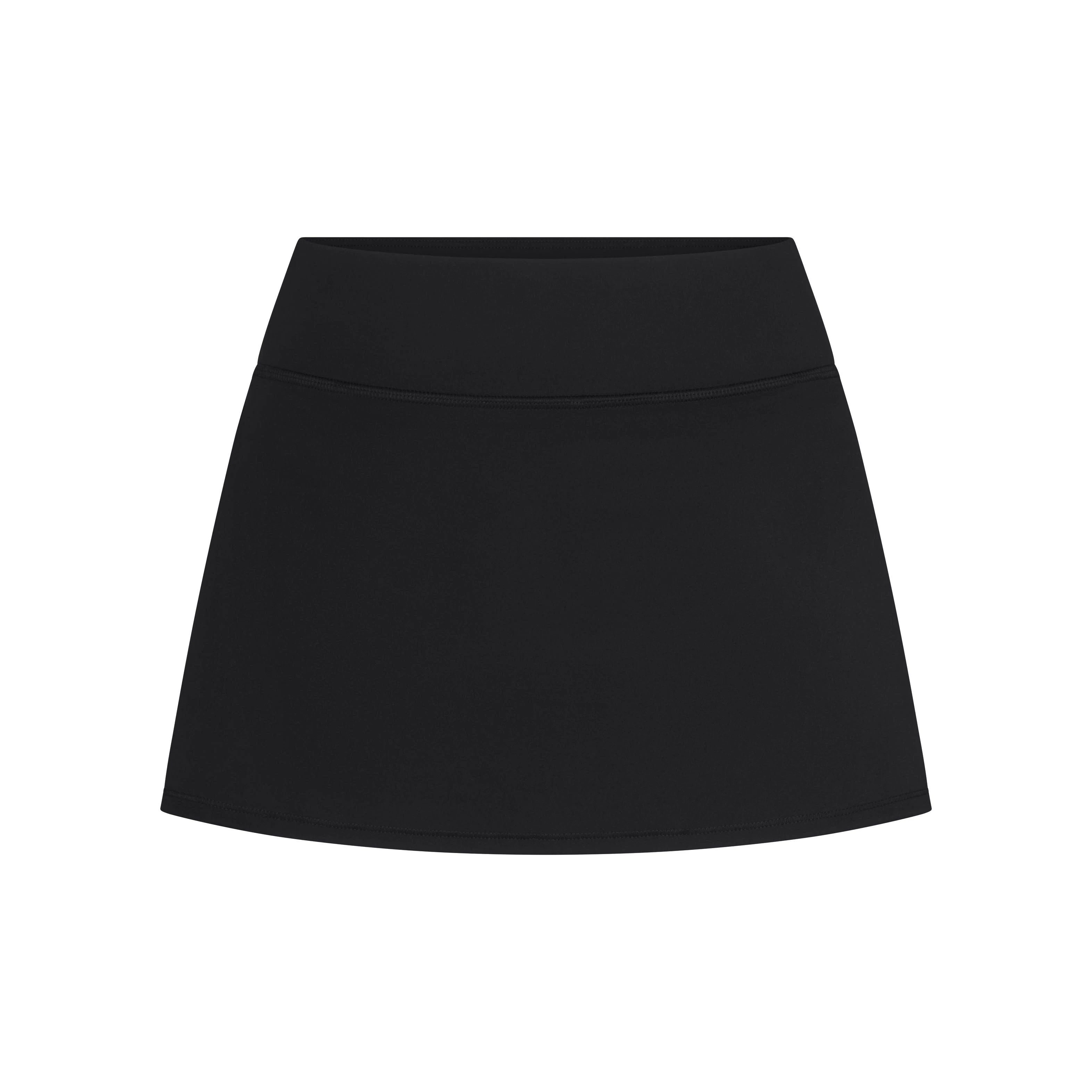 NikeSKIMS MATTE SKORT | NSKM OBSIDIAN LAYS FLAT ON A WHITE BACKGROUND | FLT
