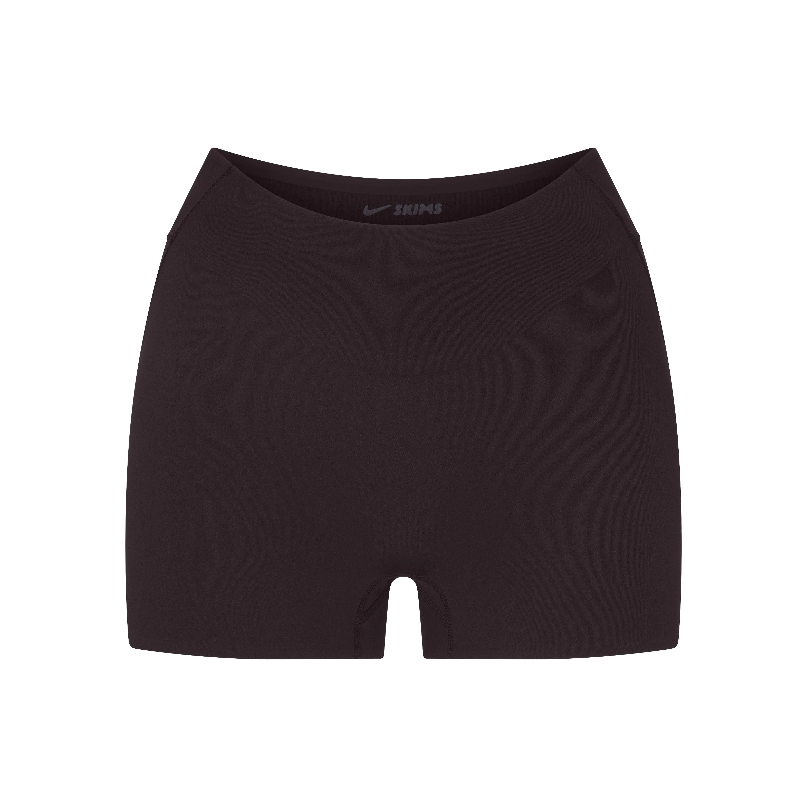 NikeSKIMS STUDIO STRETCH DIP FRONT 2" SHORT | DARK ROASTLAYS FLAT ON A WHITE BACKGROUND | FLT