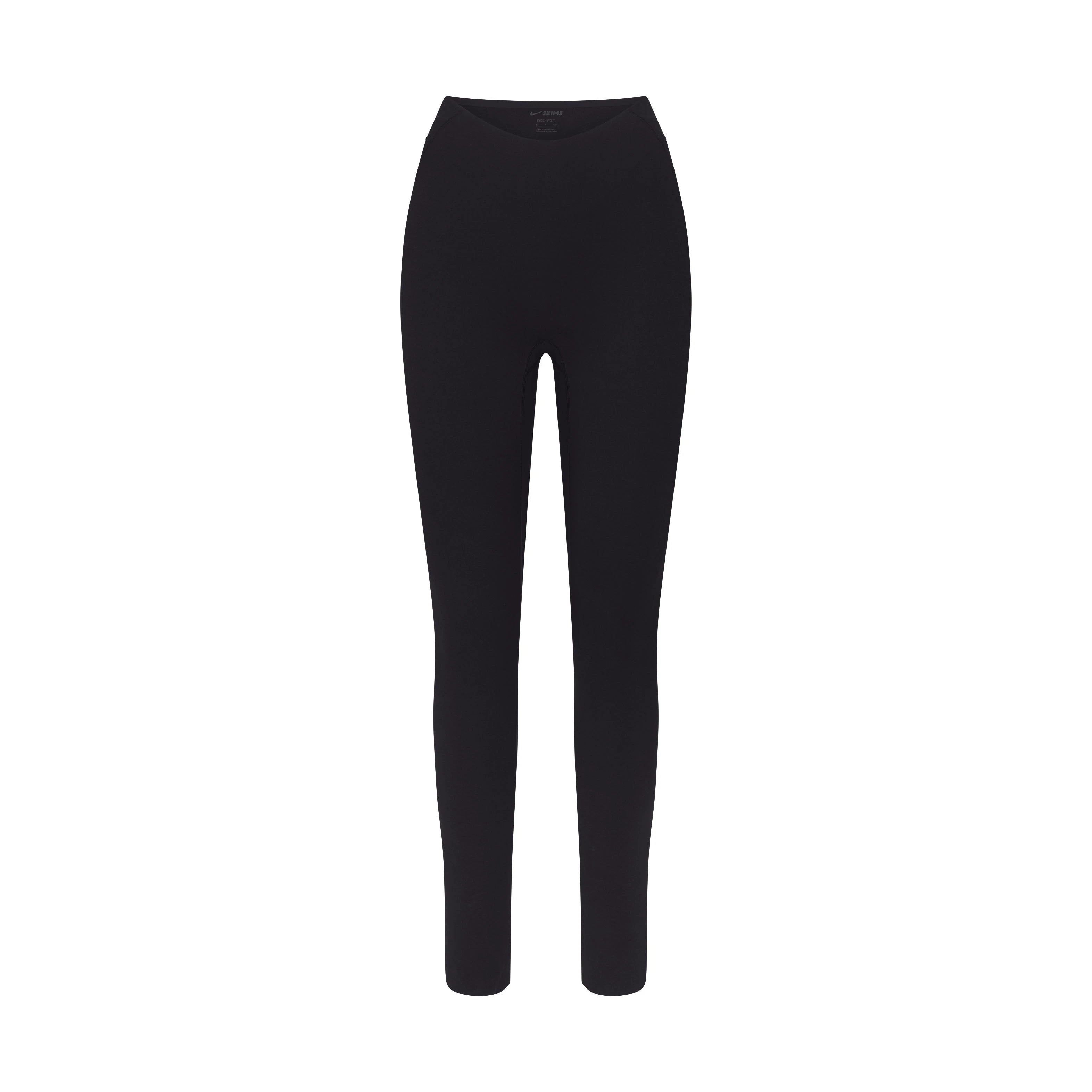 NikeSKIMS STUDIO STRETCH DIPPED 29" LEGGING | OBSIDIAN LAYS FLAT ON A WHITE BACKGROUND | FLT