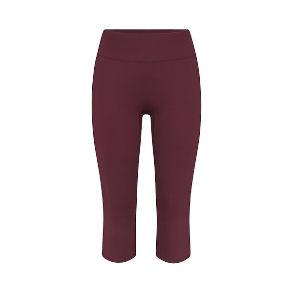 NikeSKIMS MATTE CROP 17" LEGGING | CURRANT FLAT ON A WHITE BACKGROUND | FLT