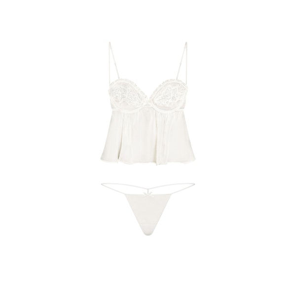 SKIMS ROMANCE BABYDOLL TOP AND STRING THONG SET | IVORY LAYS FLAT ON A WHITE BACKGROUND | FLT 