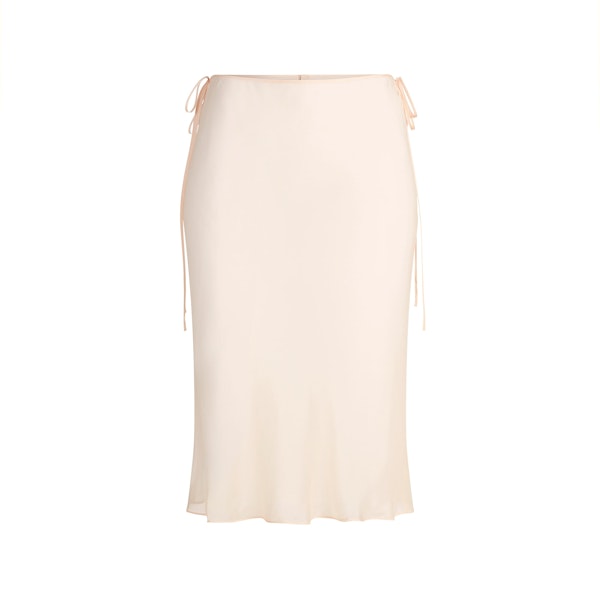 SKIMS ROMANCE MIDI SKIRT | PRIMROSE FLAT ON A WHITE BACKGROUND | FLT