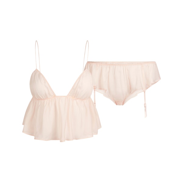 SKIMS ROMANCE BABYDOLL AND GARTER HIPSTER SET | PRIMROSE FLAT ON A WHITE BACKGROUND | FLT