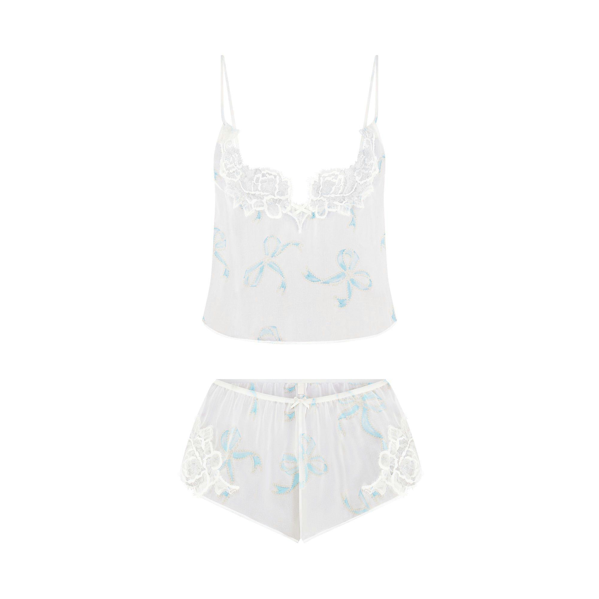 SKIMS ROMANCE CAMI AND SHORT SET | IVORY PEARL BOWS PRINT FLAT ON A WHITE BACKGROUND | FLT