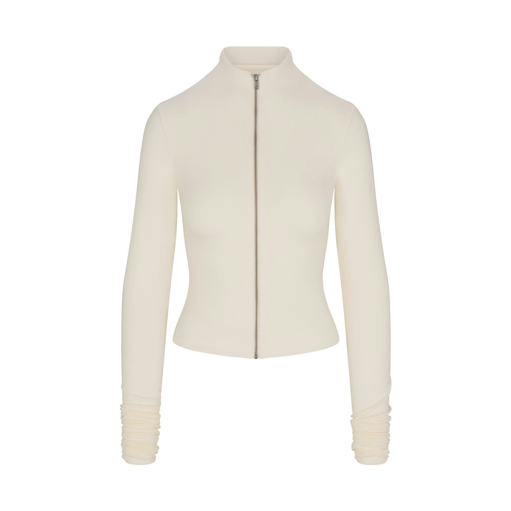 SKIMS CLOUD ZIP UP TOP | ECRU FLAT ON A WHITE BACKGROUND | FLT | FLT