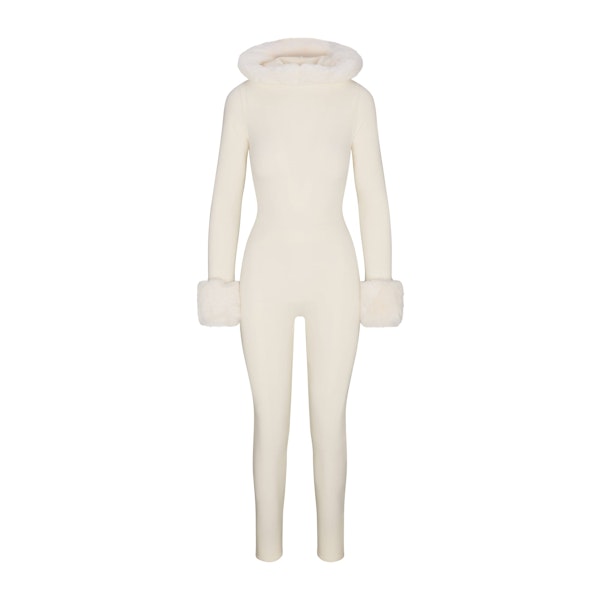SKIMS CLOUD HOODED CATSUIT | ECRU FLAT ON A WHITE BACKGROUND | FLT