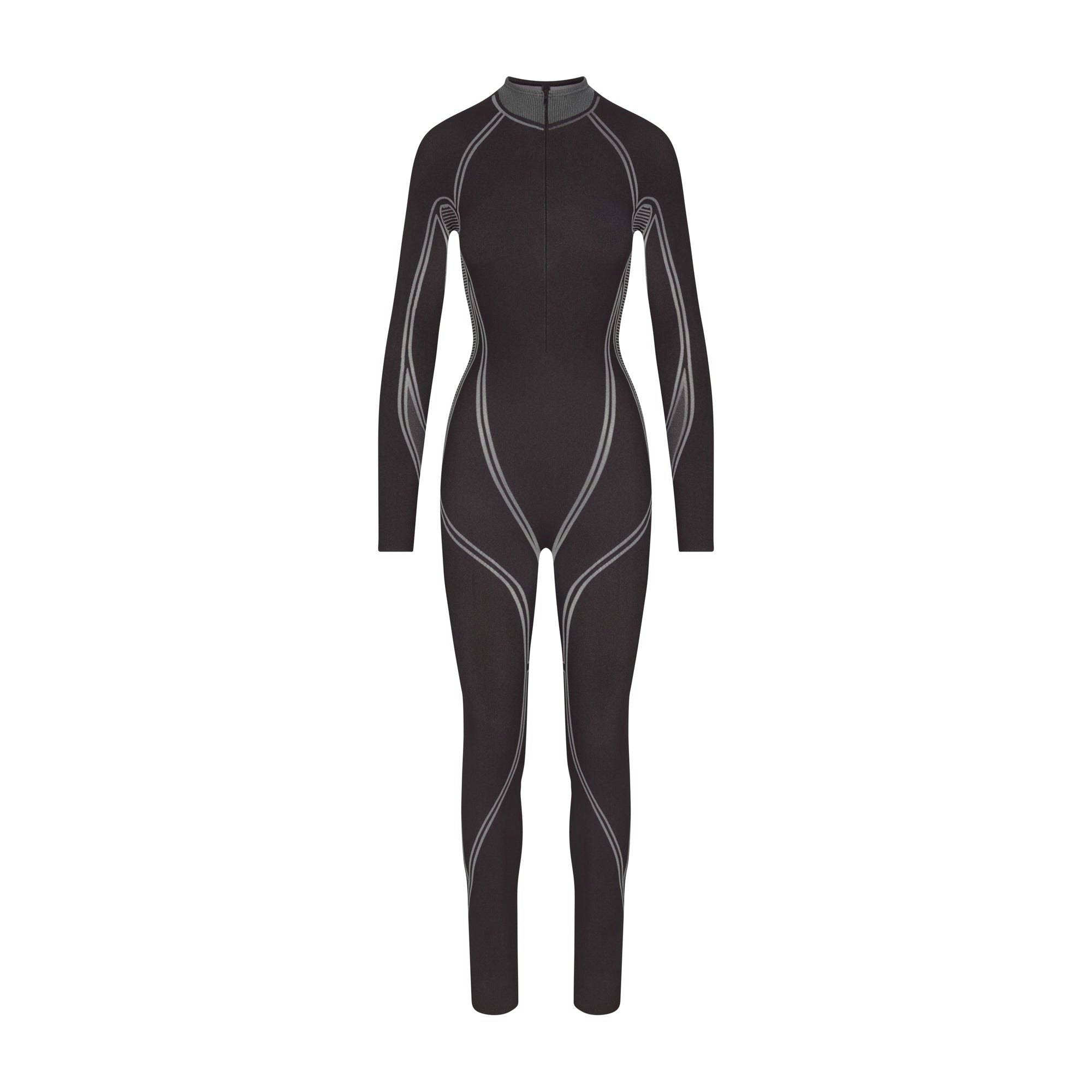 SKIMS FIRST LAYERS ZIP FRONT CATSUIT | ONYX (CATSUITS, BODYSUITS) LAYS FLAT ON A WHITE BACKGROUND