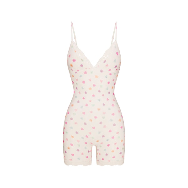 FITS EVERYBODY LACE TRIANGLE ONESIE | MARBLE CANDY HEART PRINT FLAT ON A WHITE BACKGROUND | FLT