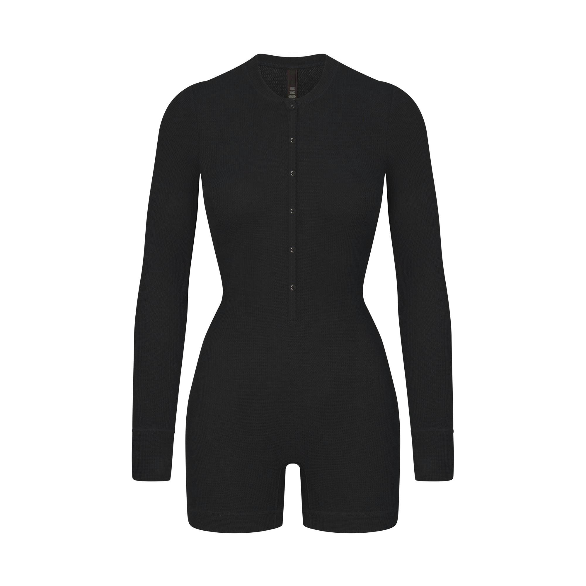 WAFFLE BUTTON UP HENLEY ONESIE LAYS FLAT ON A WHITE BACKGROUND