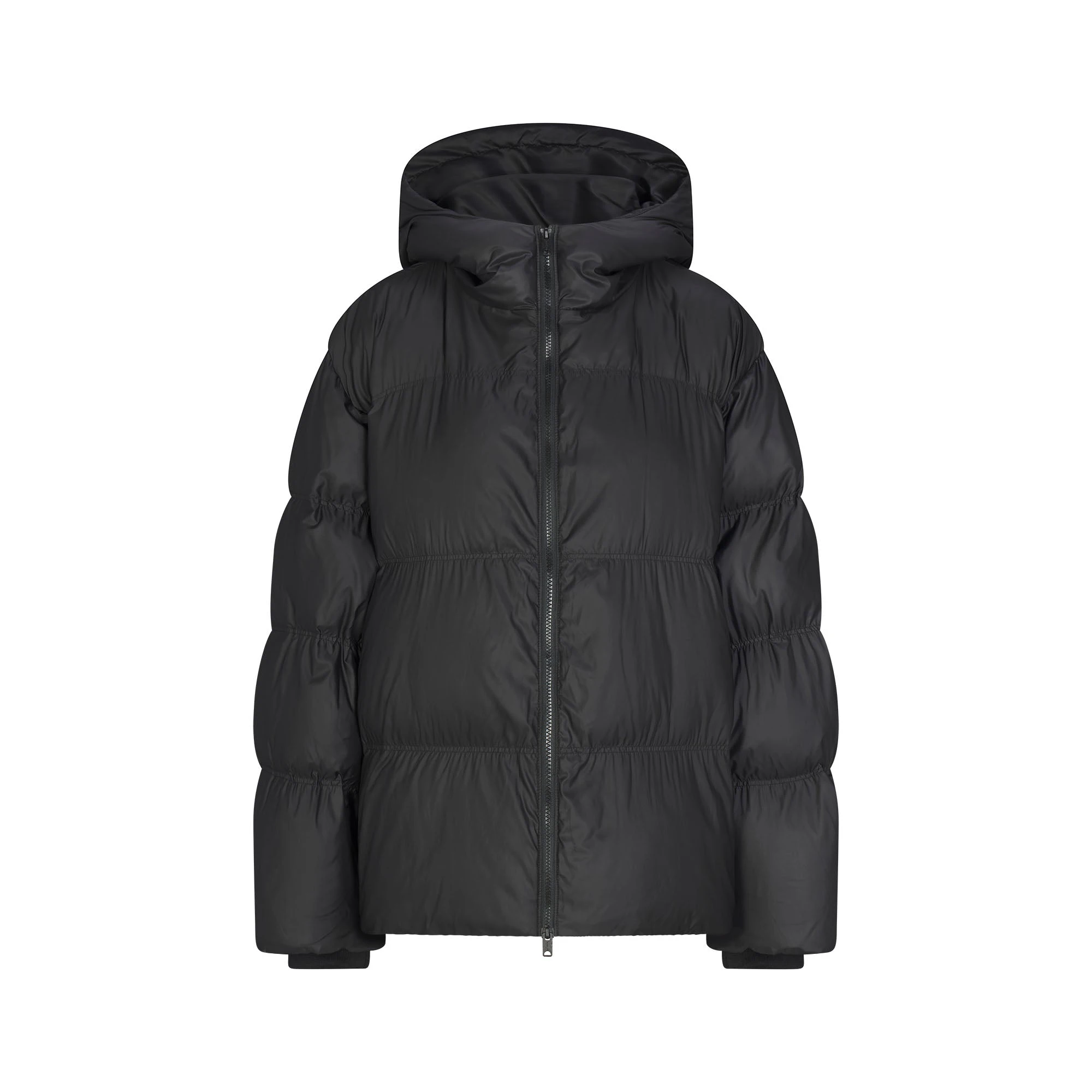 SKIMS PUFFERS HOODED JACKET | ONYX FLAT ON A WHITE BACKGROUND | FLT