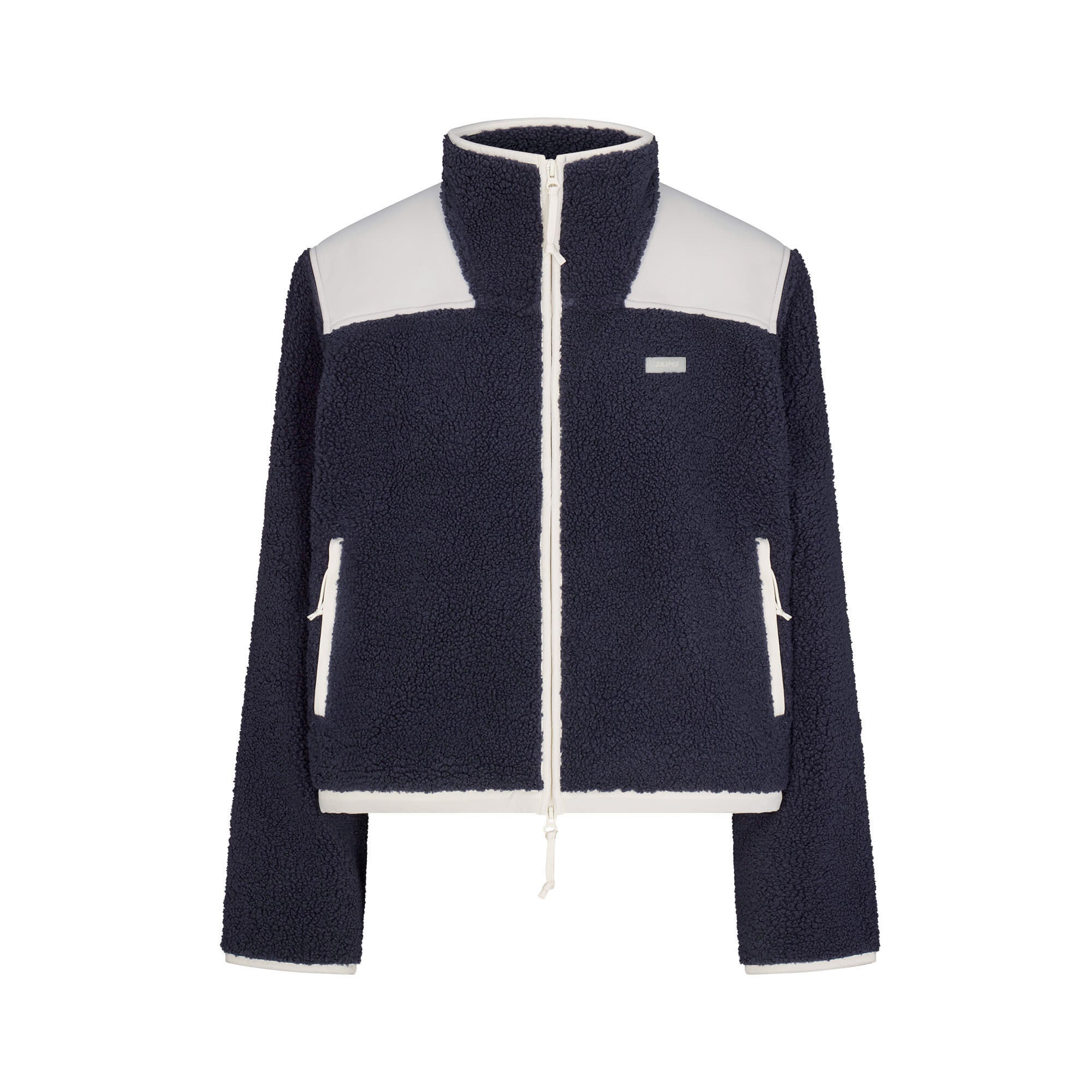 TEDDY BOXY ZIP UP JACKET | NAVY & LAYS FLAT ON A WHITE BACKGROUND | FLT