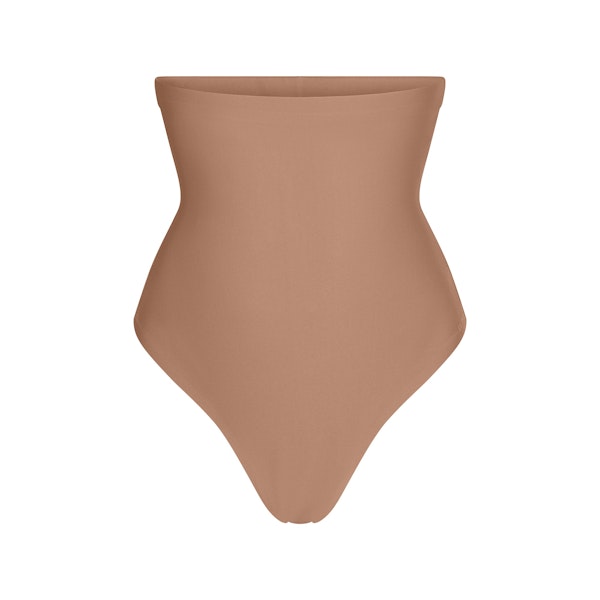 SKIMS BODY CORE SCULPT HIGH-WAISTED THONG | SIENNA FLAT ON A WHITE BACKGROUND | FLT | FLT