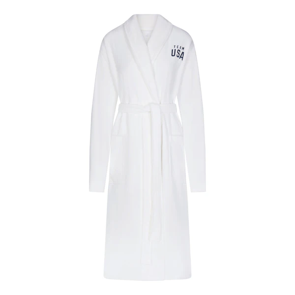 SKIMS FOR TEAM USA TERRY PARALYMPIC UNISEX ROBE | WHITE LAYS FLAT ON A WHITE BACKGROUND | FLT