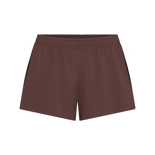 NikeSKIMS AIRY MINI SHORT | DARK SEPIA FLAT ON A WHITE BACKGROUND | FLT