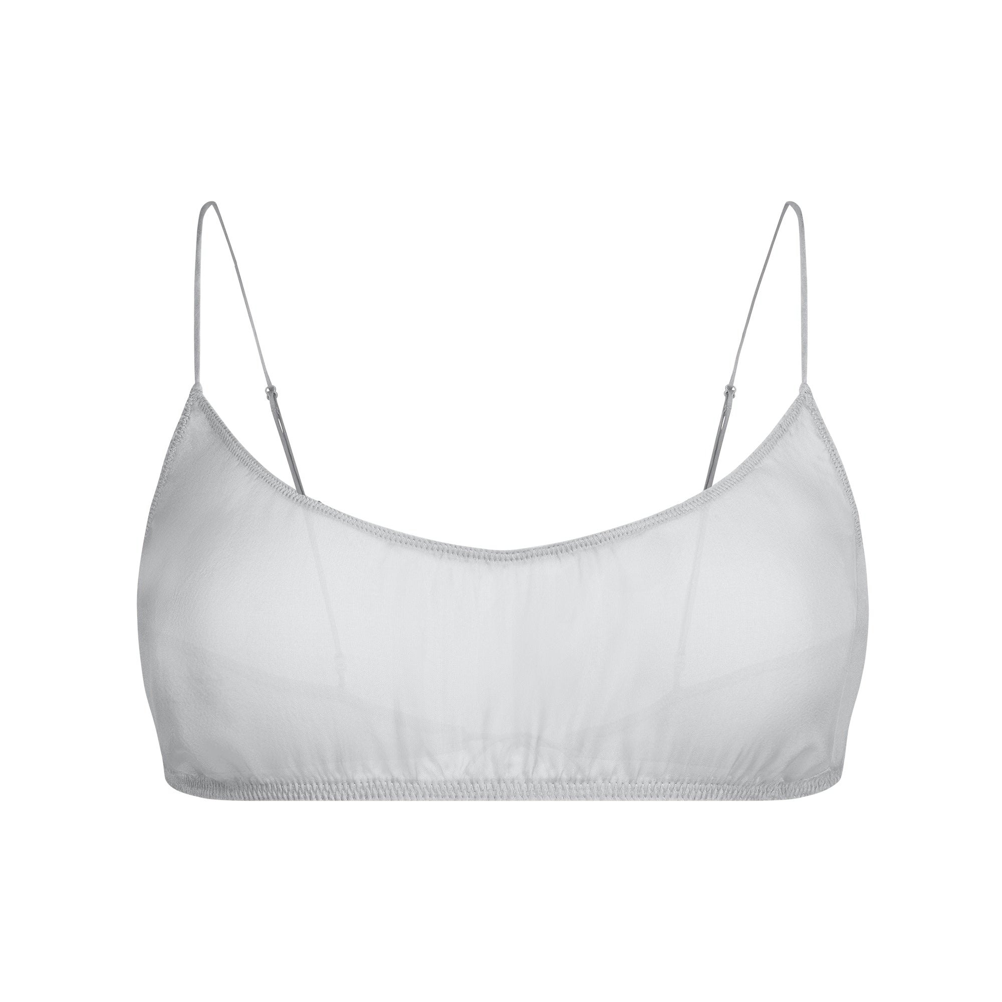 SKIMS ROMANCE BRALETTE AND SKIRT SET | MIRROR FLAT ON A WHITE BACKGROUND | FLT