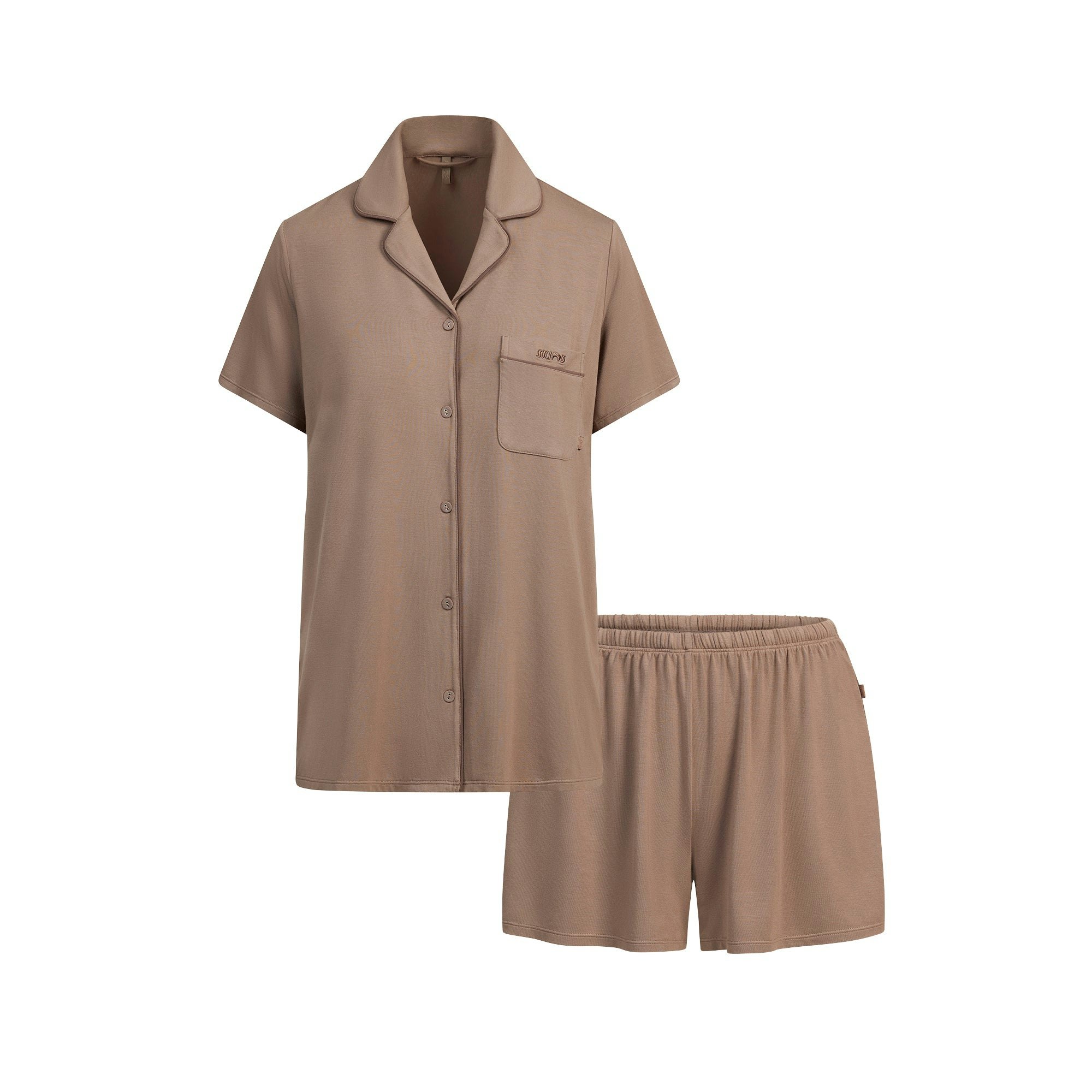 SKIMS SLEEP SHORT SLEEVE BUTTON UP SET | FOSSIL FLAT ON A WHITE BACKGROUND | FLT