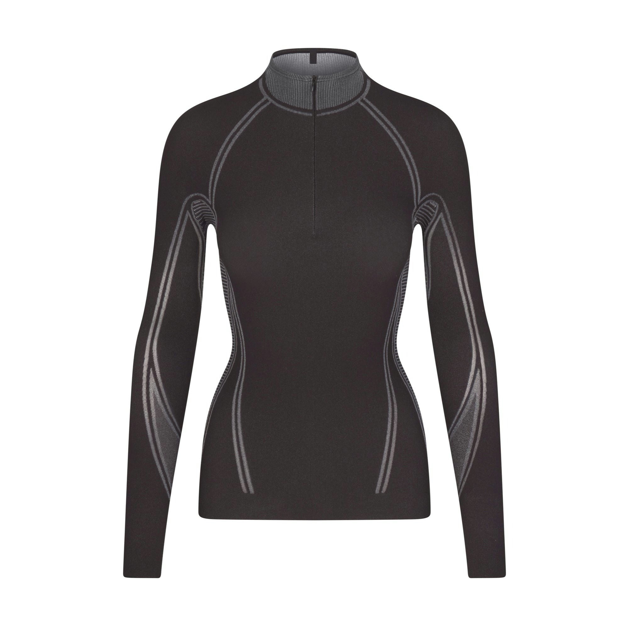 SKIMS FIRST LAYERS TURTLENECK TOP | ONYX (TURTLENECK TOPS) LAYS FLAT ON A WHITE BACKGROUND