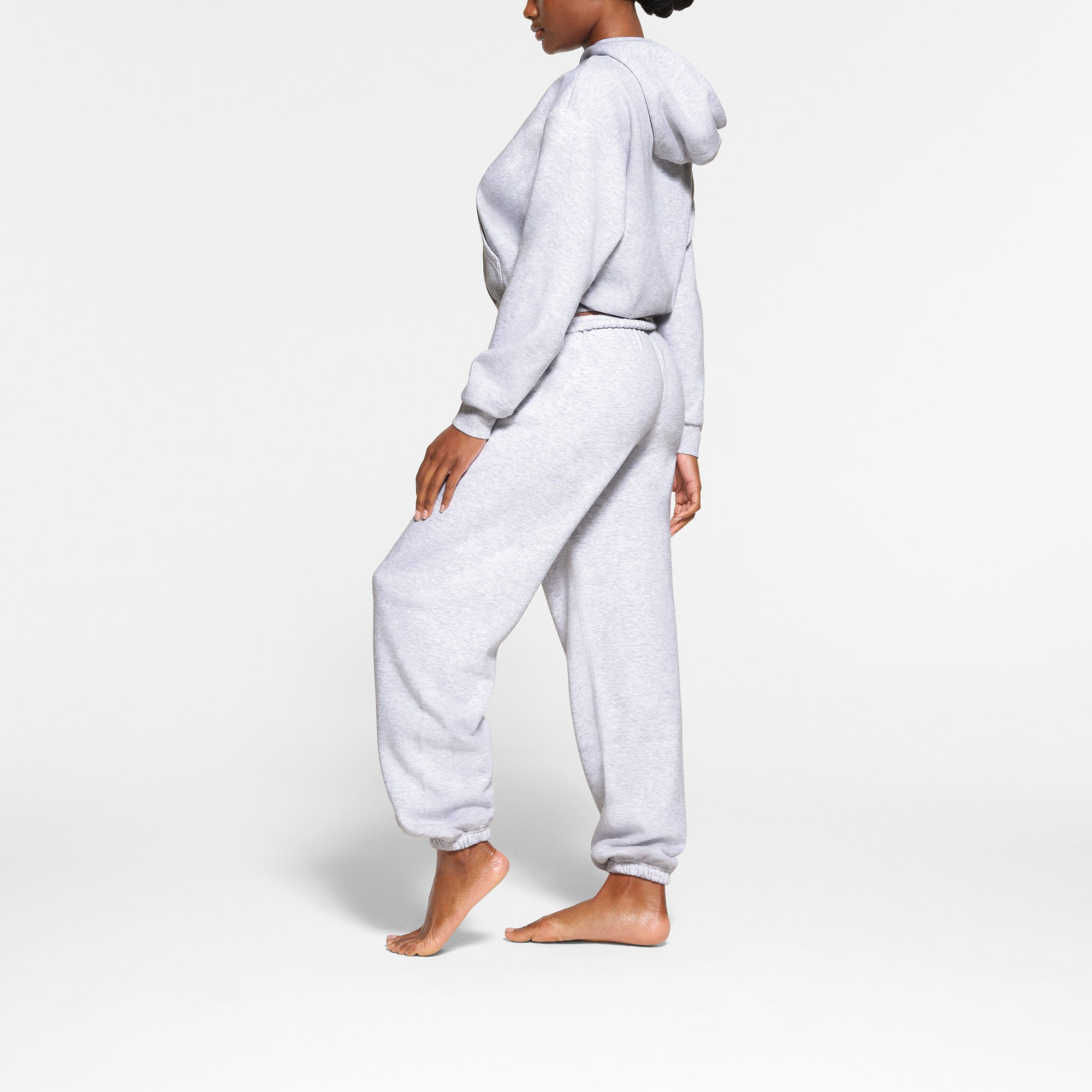 COTTON FLEECE CLASSIC HOODIE WORN BY A MODEL IN SIDE VIEW