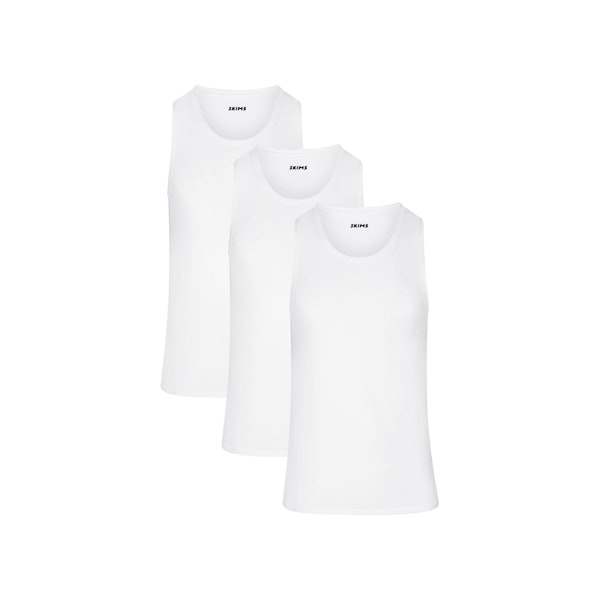 SKIMS STRETCH MENS TANK 3-PACK | CHALK (MENS BUNDLES, MENS TOPS) LAYS FLAT ON A WHITE BACKGROUND | FLT | FOCUS: 0.0, 1.0, 0.9
