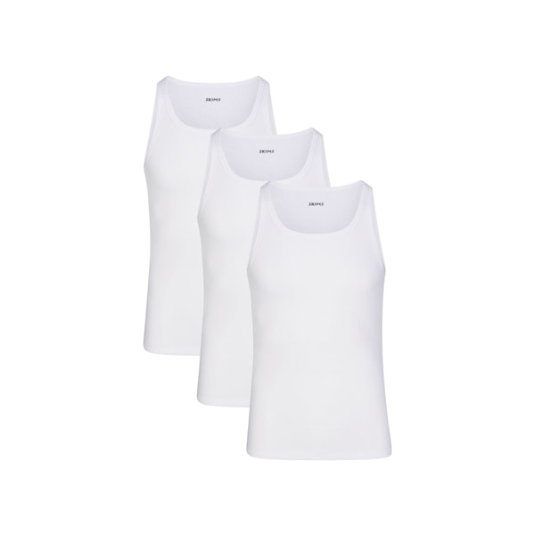 SKIMS COTTON MENS RIB TANK 3-PACK LAYS FLAT ON A WHITE BACKGROUND | FLT | FOCUS: 0.0, 1.0, 0.9