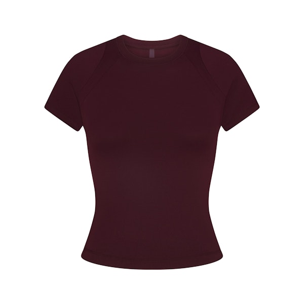 NikeSKIMS AIRY BABY TEE | CURRANT FLAT ON A WHITE BACKGROUND | FLT
