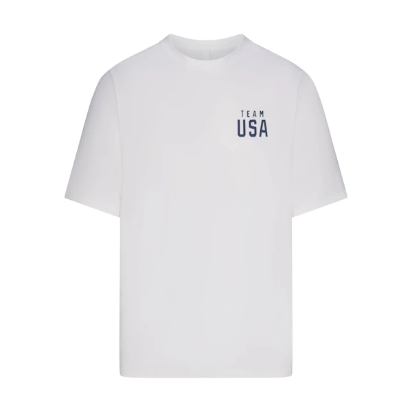 SKIMS FOR TEAM USA JERSEY SLEEP MENS PARALYMPIC T-SHIRT | WHITE (MENS T-SHIRTS, MENS TOPS) FLAT ON A WHITE BACKGROUND