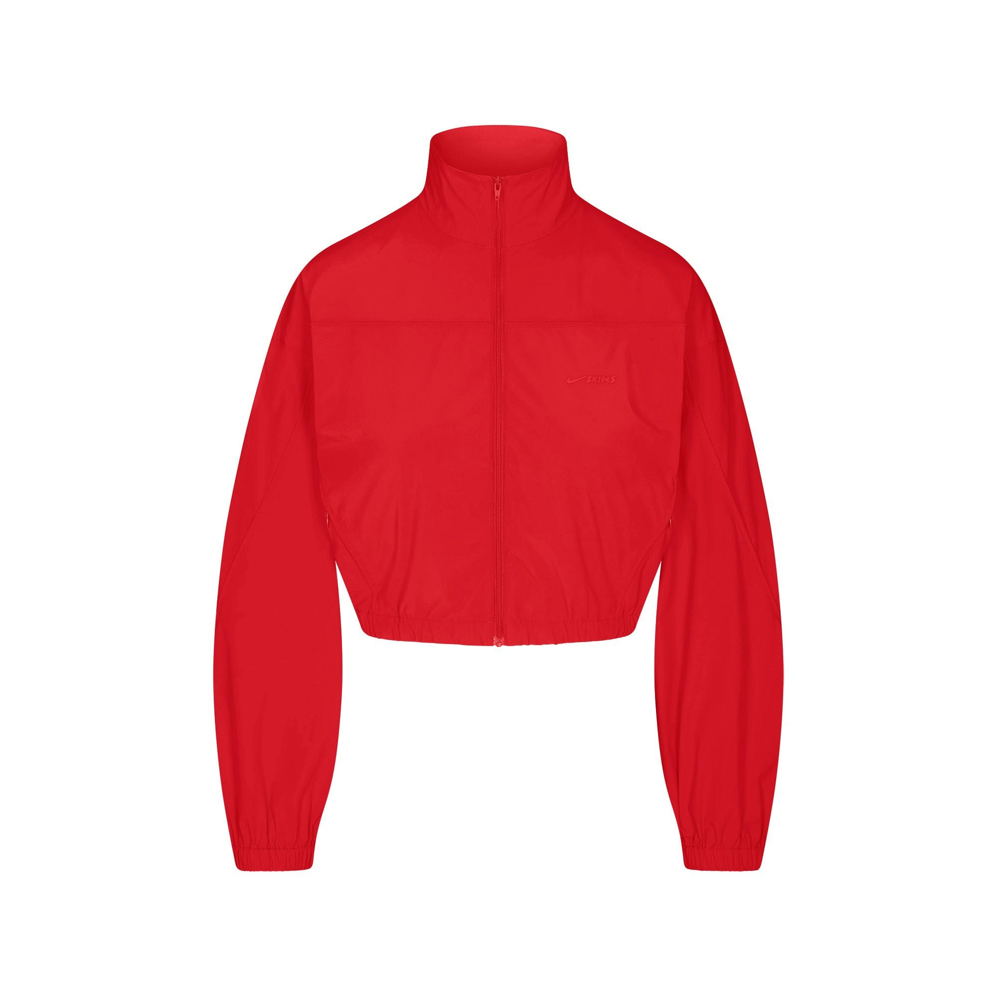 NikeSKIMS WOVEN NYLON CROP JACKET | RUBY FLAT ON A WHITE BACKGROUND | FLT