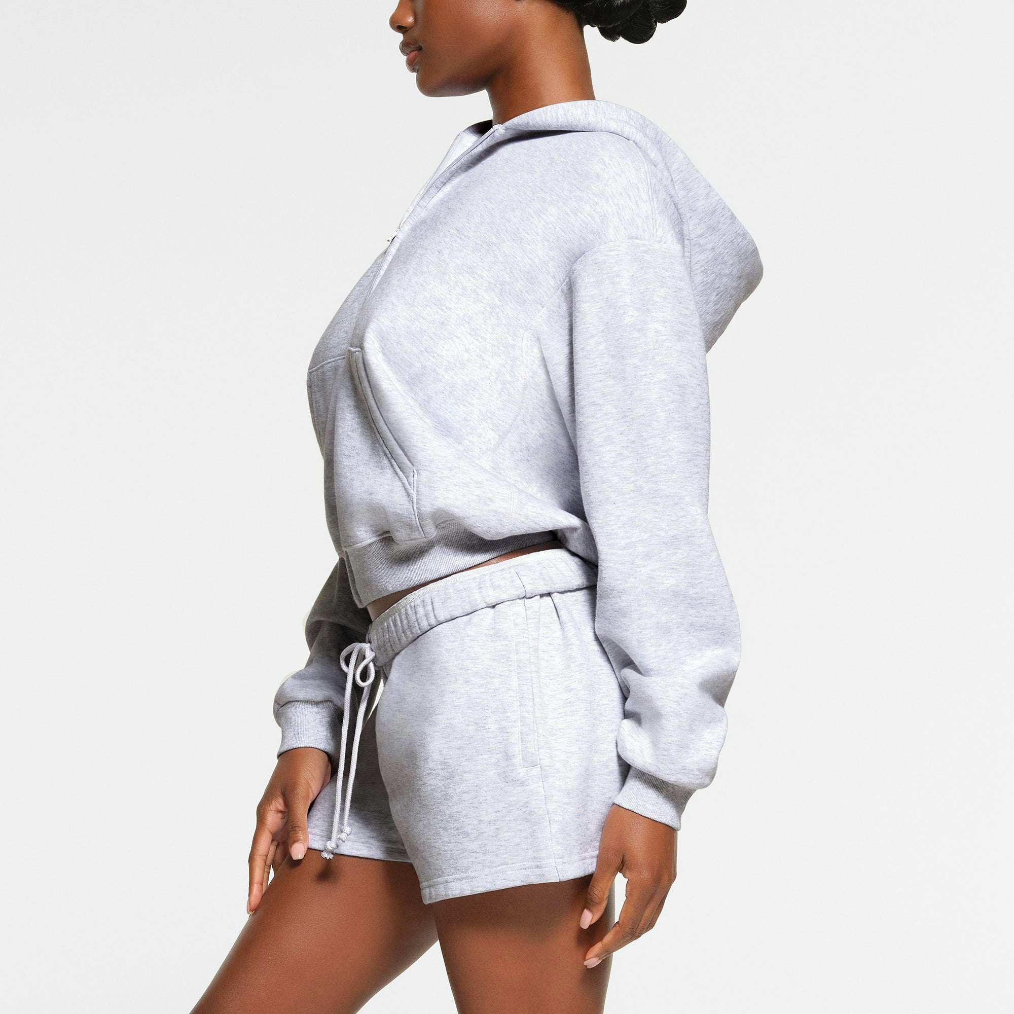COTTON FLEECE CLASSIC ZIP UP HOODIE WORN BY A MODEL IN SIDE VIEW
