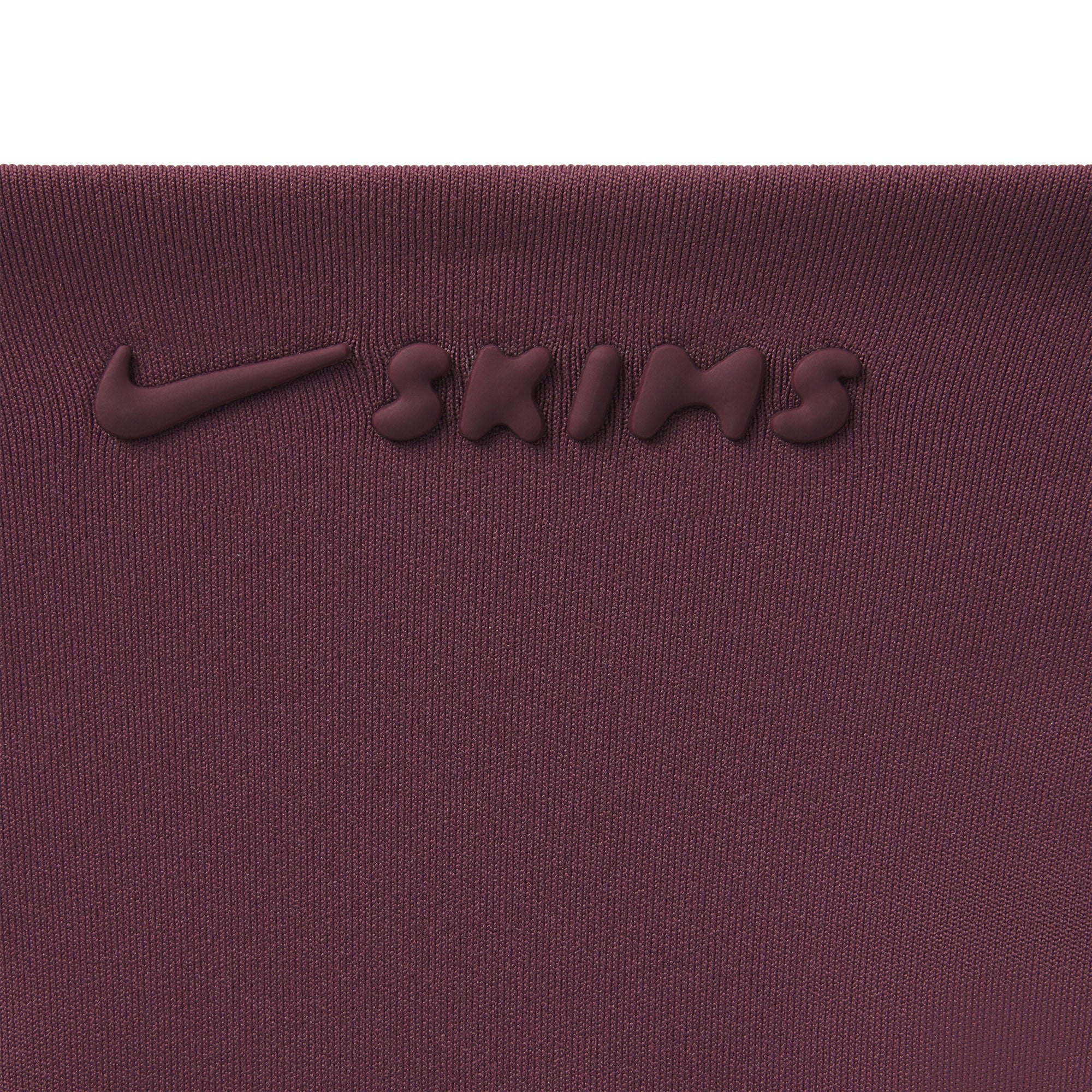 NikeSKIMS MATTE RACER BACK TANK | CURRANT ON A MODEL SIDE VIEW @ | FOCUS: 0.0, 1.0, 0.9