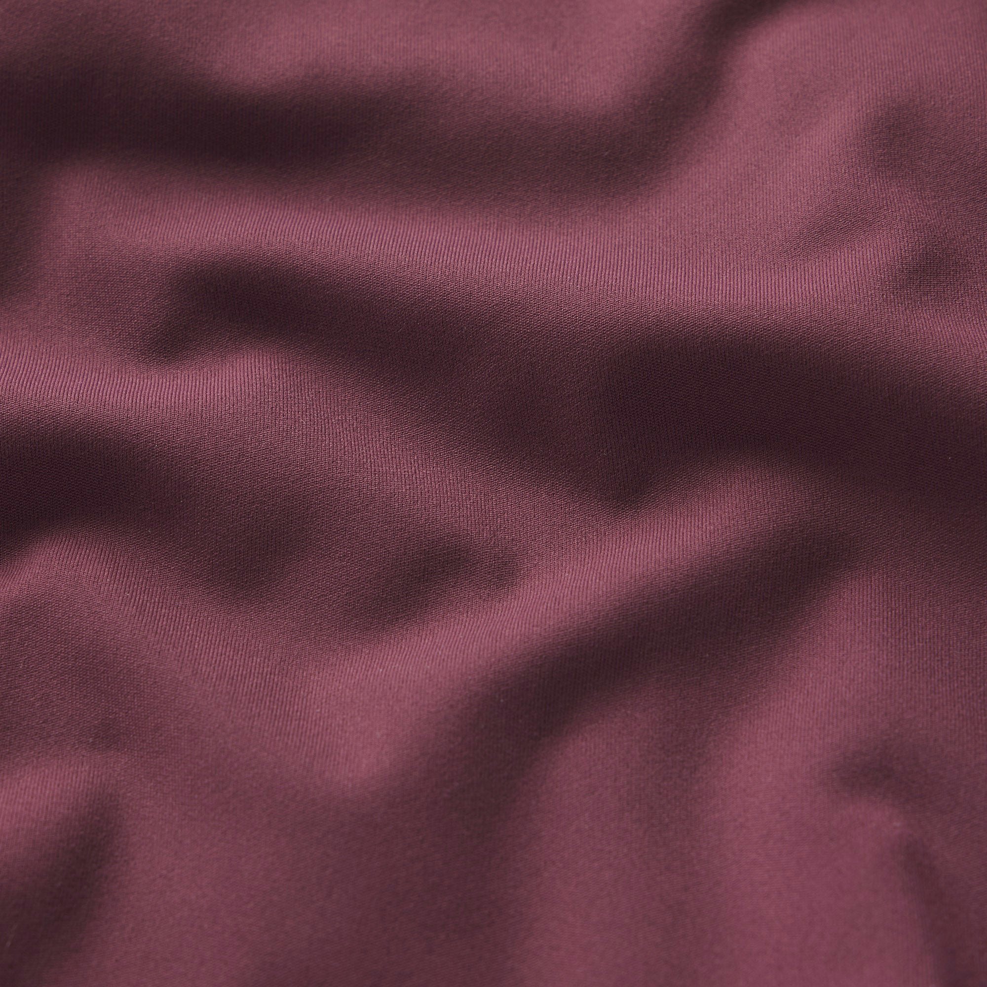 NikeSKIMS MATTE RACER BACK TANK | CURRANT ON A MODEL SIDE VIEW @ | FOCUS: 0.0, 1.0, 0.9