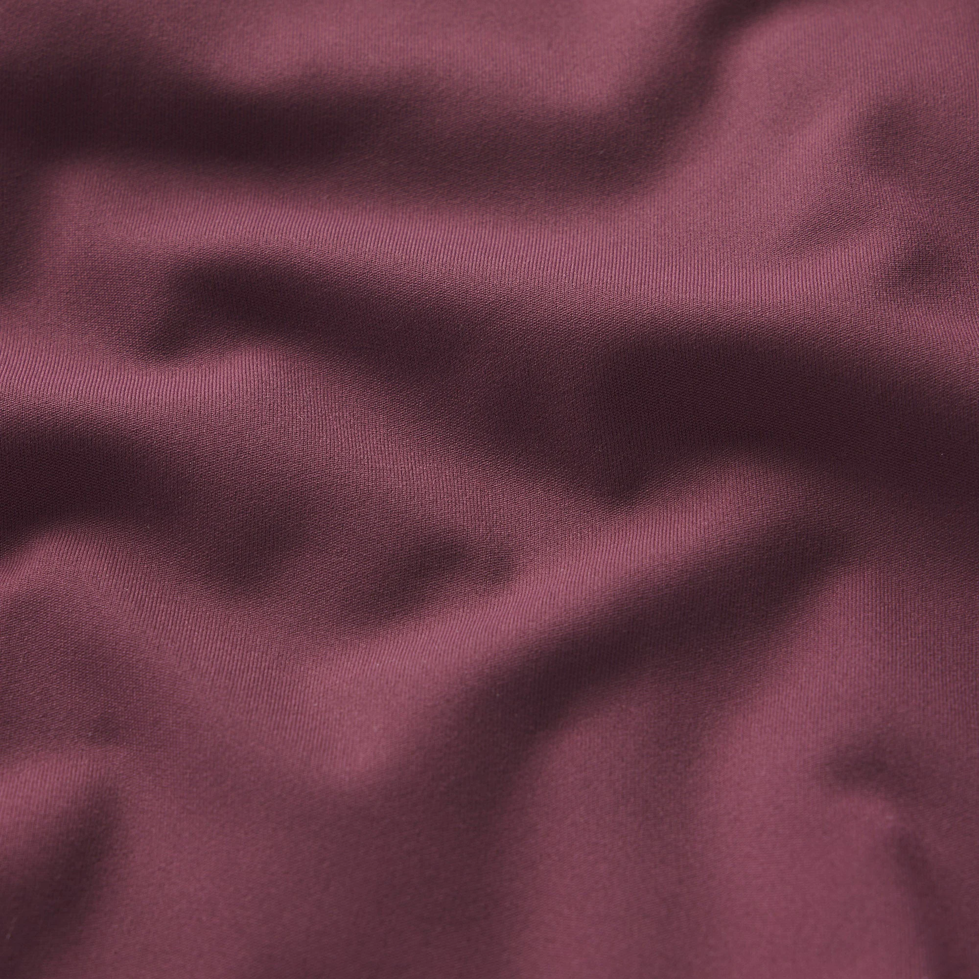 NikeSKIMS MATTE RACER BACK TANK | CURRANT ON A MODEL SIDE VIEW @ | FOCUS: 0.0, 1.0, 0.9