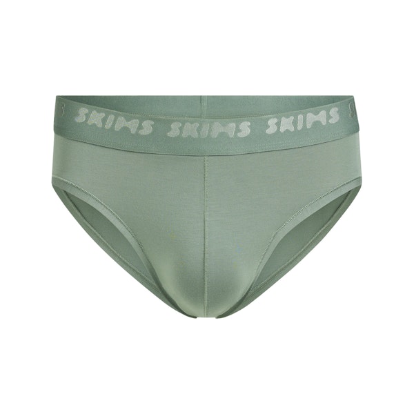 SKIMS STRETCH MENS BRIEF | LAUREL FLAT ON A WHITE BACKGROUND | FLT