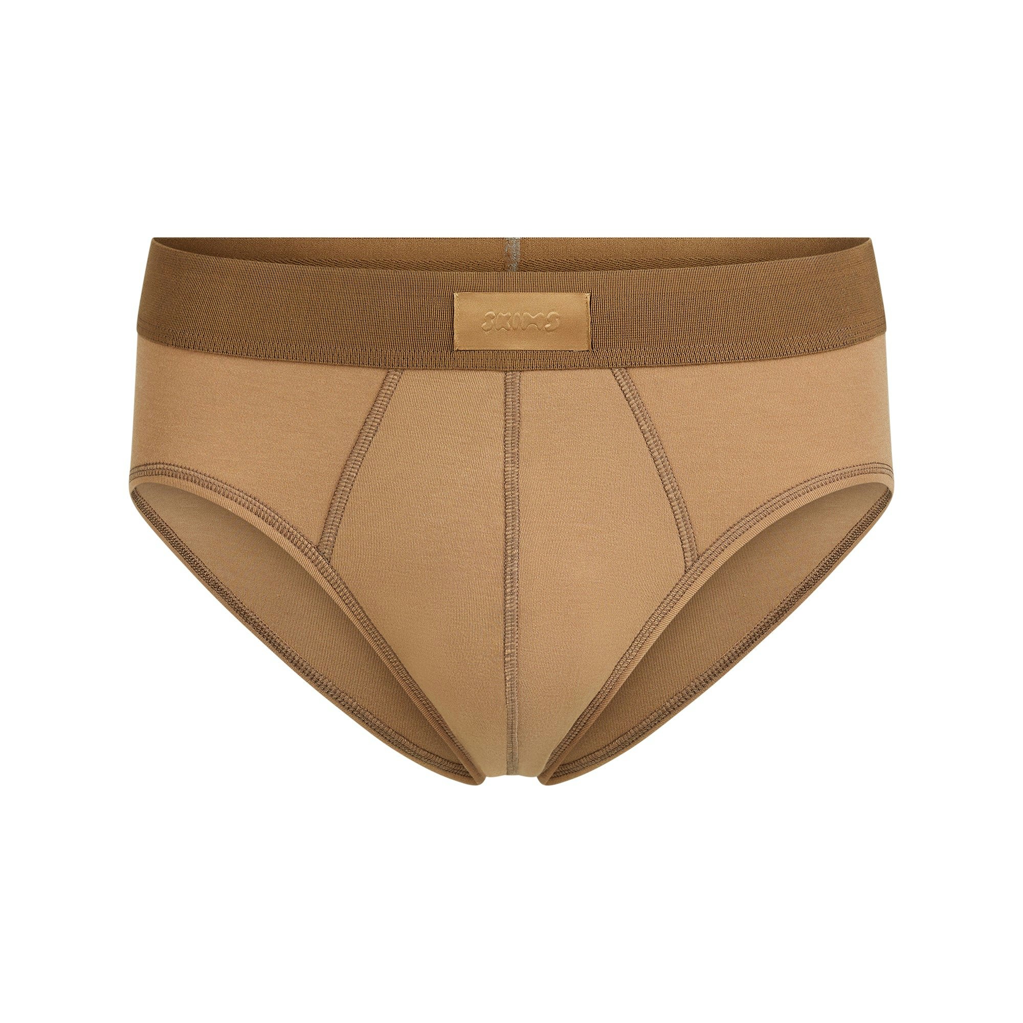 SKIMS COTTON MENS BRIEF | RUSSET FLAT ON A WHITE BACKGROUND | FLT