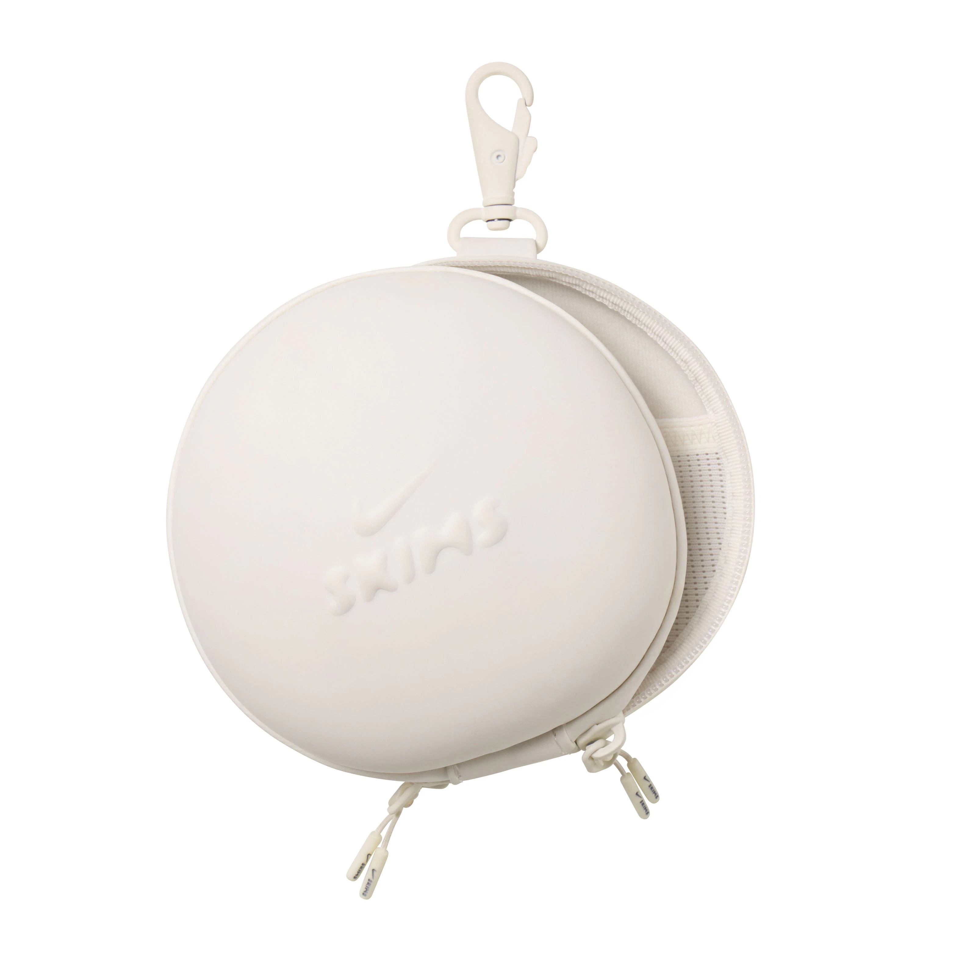 NikeSKIMS ACCESSORIES HARDSHELL ROUND CASE | IVORYON A MODEL VIEW @ | FOCUS: 0.0, 1.0, 0.9