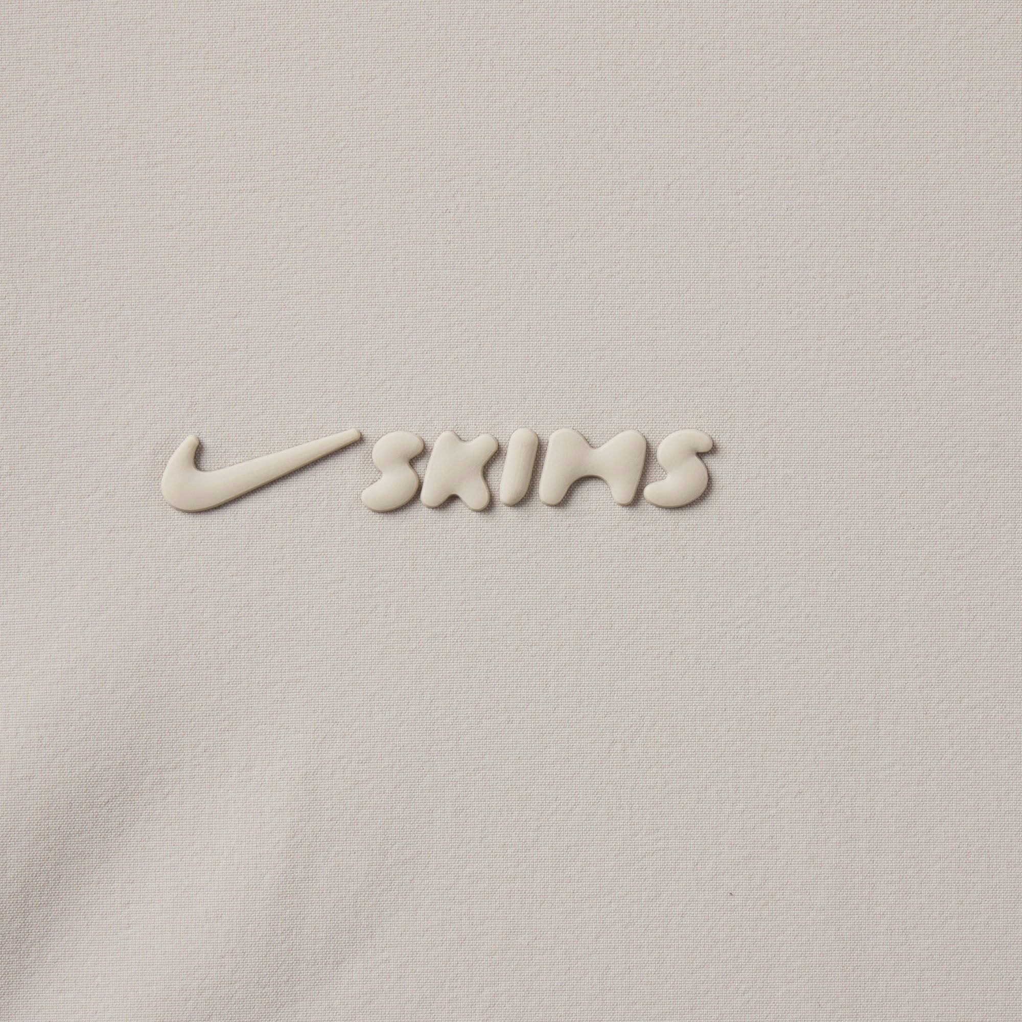 NikeSKIMS WOVEN NYLON OVERSIZED TRACK JACKET | STONE ADDITIONAL FABRIC DETAILS