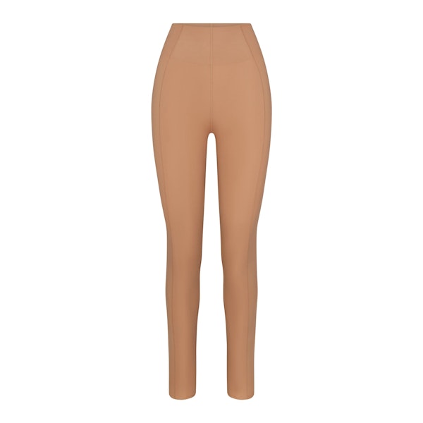 THE NORTH FACE X SKIMS REFINA LEGGING | OCHRE FLAT ON A WHITE BACKGROUND | FLT