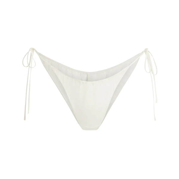 SKIMS ROMANCE TIE SIDE BIKINI | IVORY FLAT ON A WHITE BACKGROUND | FLT