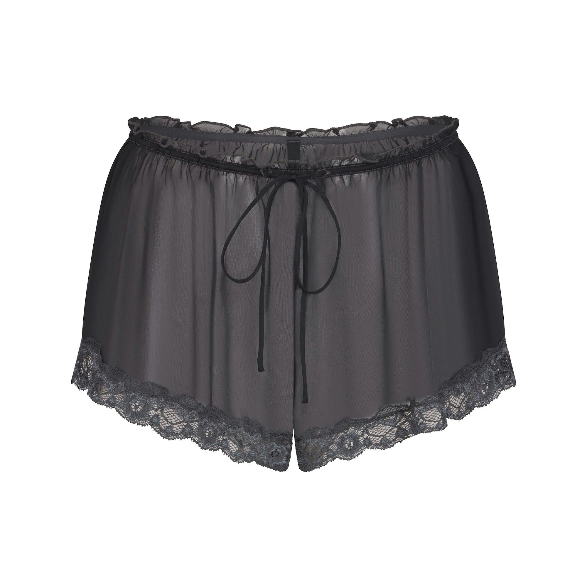 SKIMS ROMANCE LACE SHORT | ONYX (SHORTS, BOTTOMS) FLAT ON A WHITE BACKGROUND | FLT