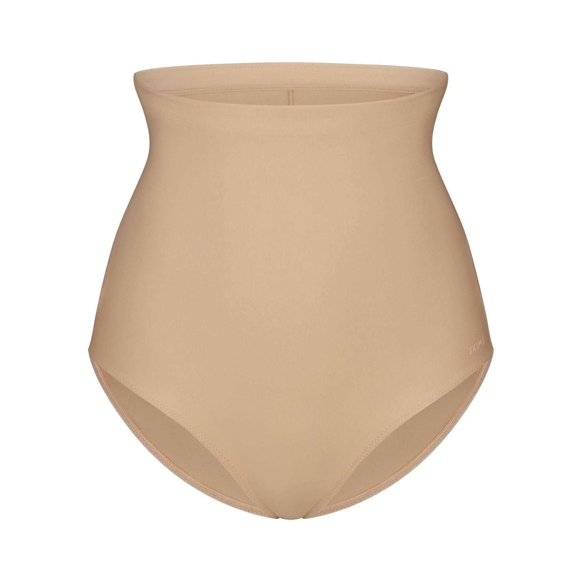 SKIMS BODY CORE SCULPT BUTT LIFTING BRIEF | CLAY FLAT ON A WHITE BACKGROUND | FLT