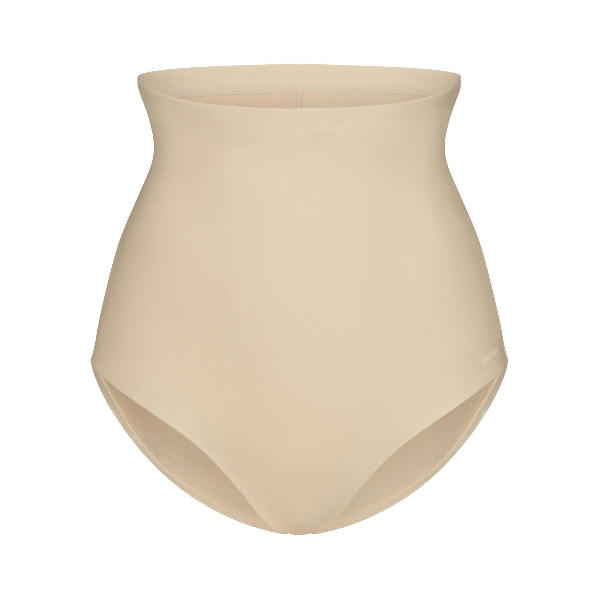 SKIMS BODY CORE SCULPT BUTT LIFTING BRIEF | SAND FLAT ON A WHITE BACKGROUND | FLT