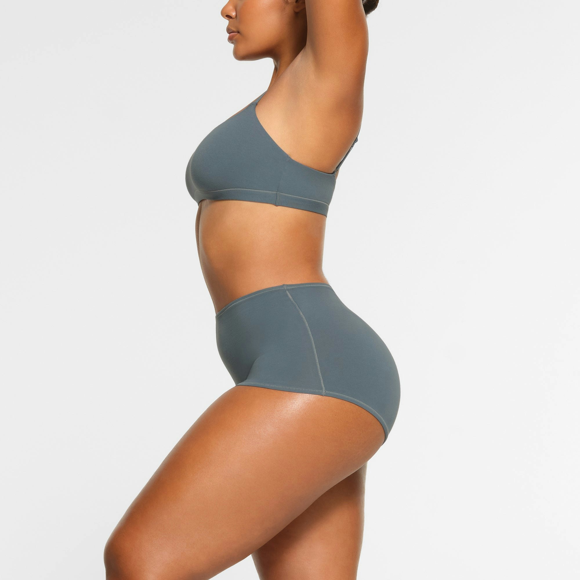 COTTON JERSEY BOY SHORT WORN BY A MODEL IN SIDE VIEW