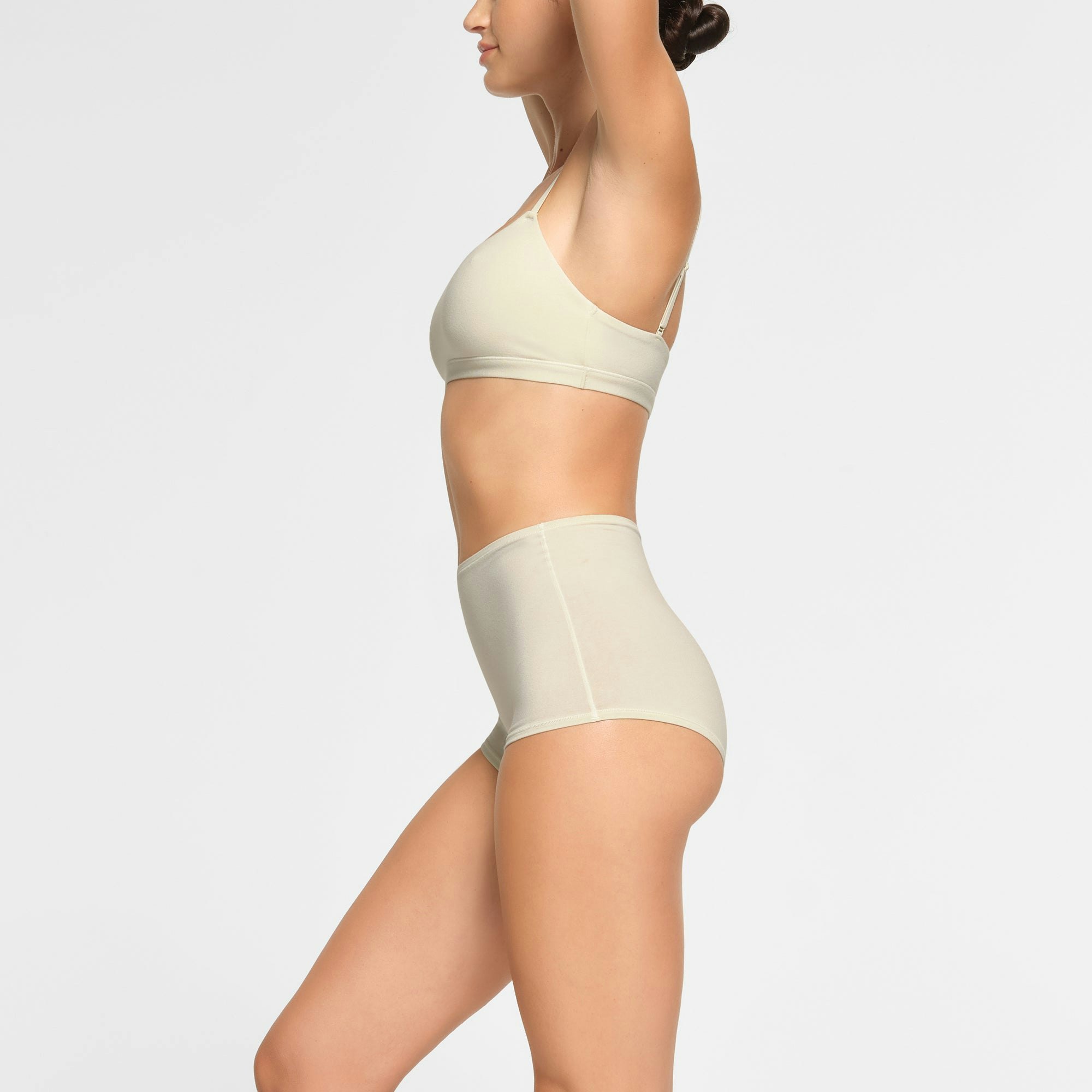 COTTON JERSEY BOY SHORT WORN BY A MODEL IN SIDE VIEW