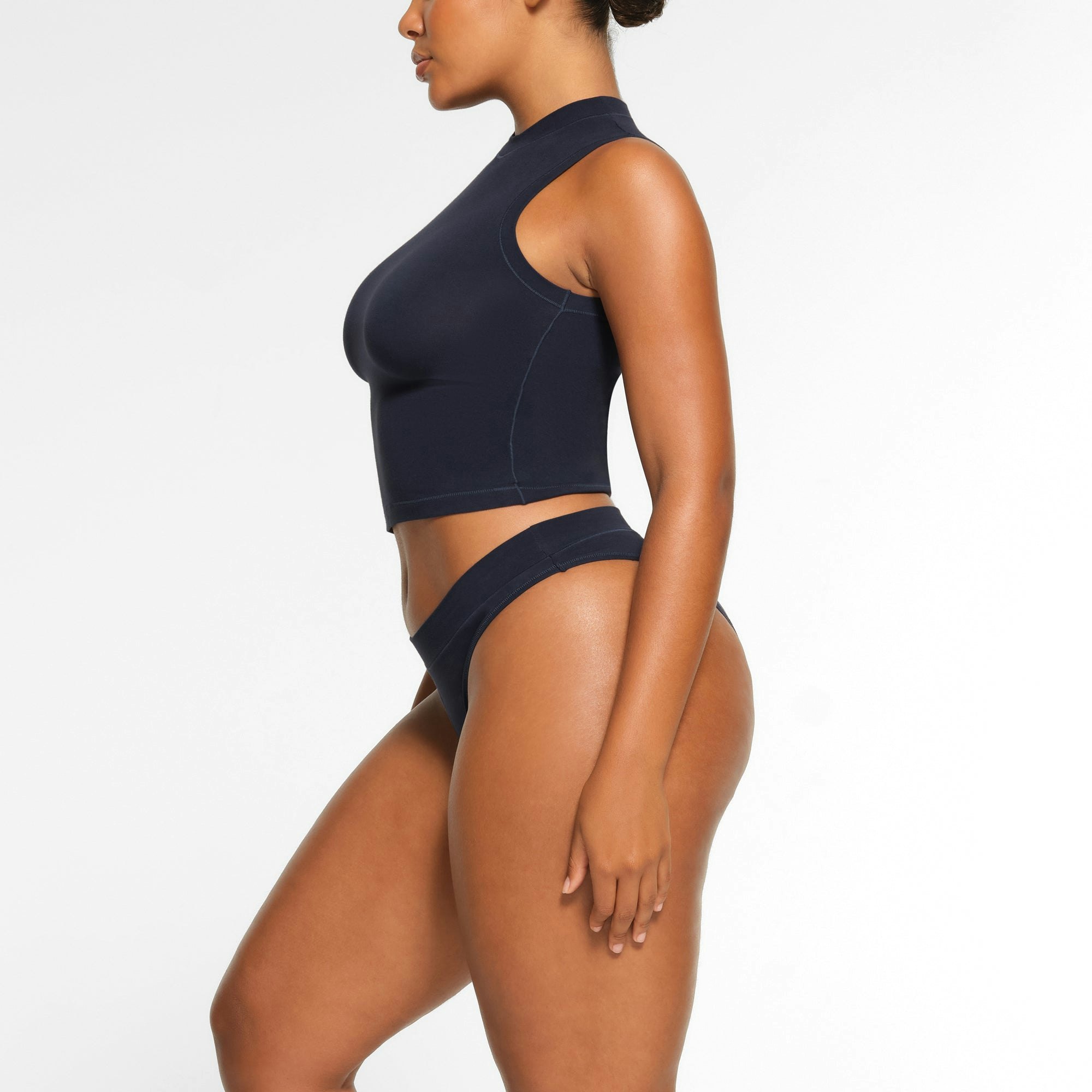 COTTON JERSEY CHEEKY TANGA WORN BY A MODEL IN SIDE VIEW