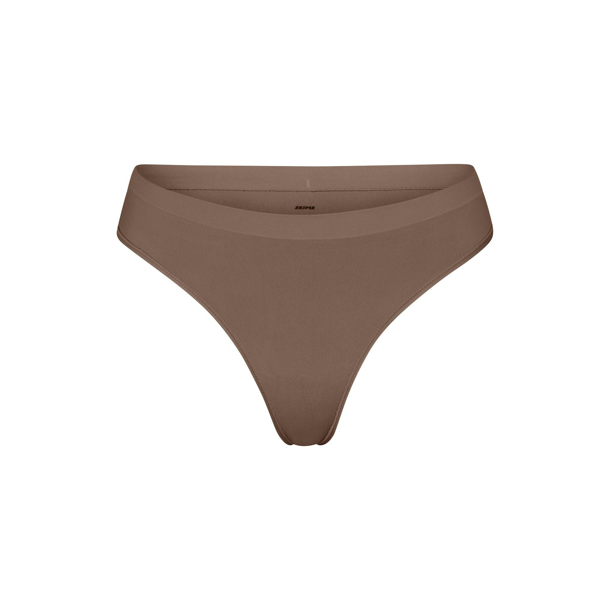 SOFT SMOOTHING SEAMLESS THONG | TRUFFLE ON A WHITE BACKGROUND